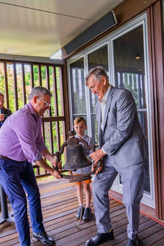 Historic-Binna-Burra-bell-rings-to-open-the-ceremony-with the help of young Binna Burra FOBBs volunteer, Mason.