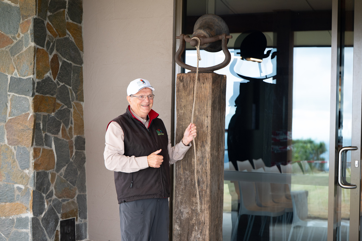 Image shows Chairperson Steve Noakes with the Binna Burra Bell