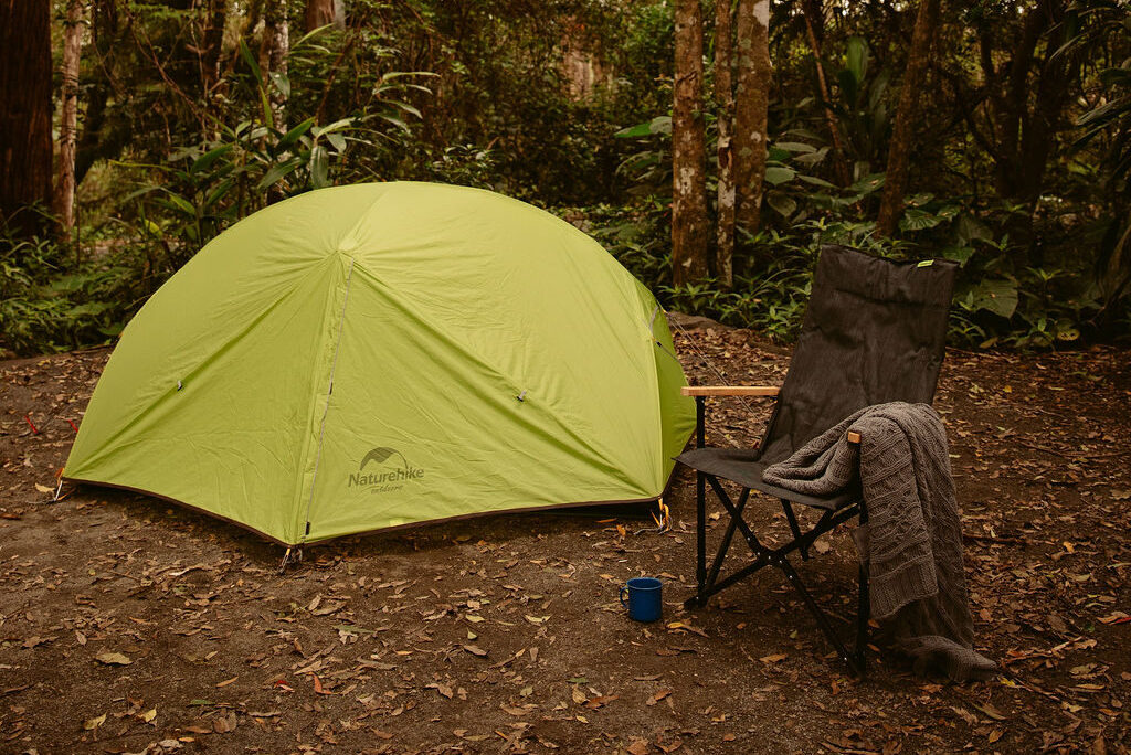 Image shows the Rainforest Campsite for campers and hikers. Close-up of camping at Binna Burra - Tent sites.